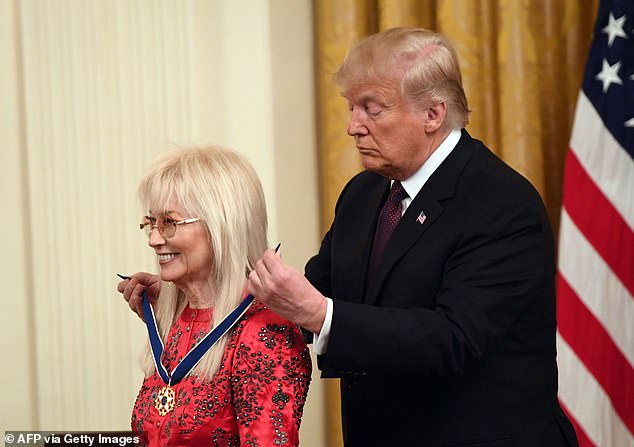 US President Donald Trump awards the Presidential Medal of Freedom to Doctor Miriam Adelson at the White House in 2018