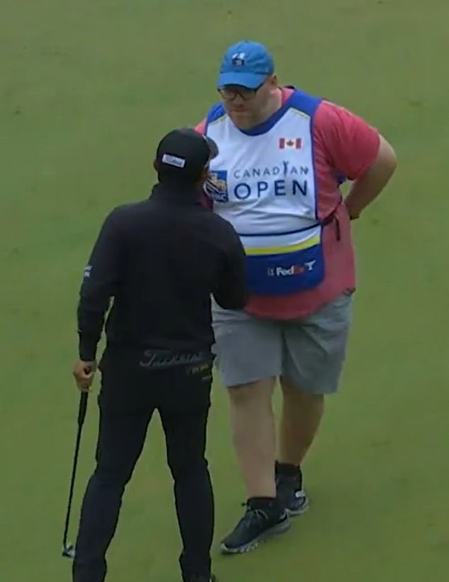 The fan shook hands with Pan on the course before settling into his new role as caddie