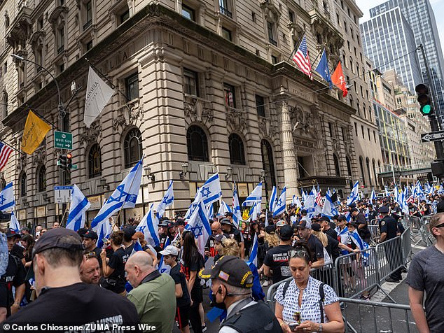 Paradegoers, families of the hostages and others prepared to march along 5th Avenue today