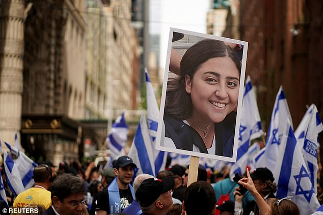 Participants held signs of hostages as they marched down Fifth Avenue