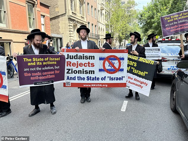 A small number of radical Hasidic Jews arrived to protest the Israel parade – their very small faction shows up to demonstrate most years