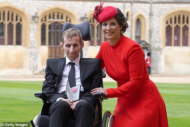 Burrow (pictured with his wife Lindsey) was awarded an MBE in the 2021 New Year's Honors