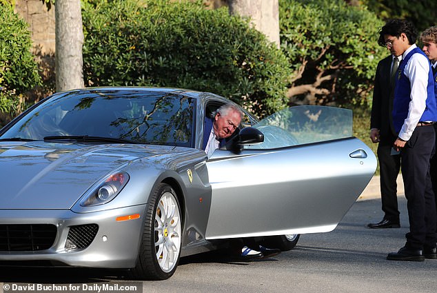 A guest arriving at the wedding of Rupert Murdoch and Elena Zhukova