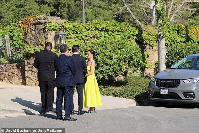 Guests gather outside Rubert Murdoch's home in California