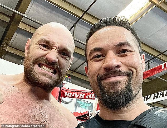 Parker (pictured with fellow heavyweight boxer Tyson Fury) is currently in one of the best shapes of his life, winning his last six fights