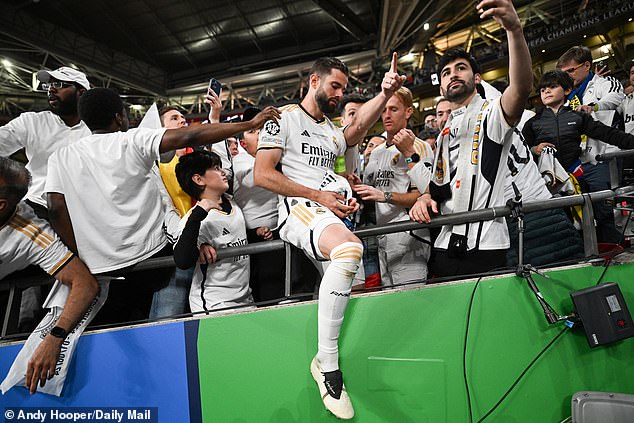 Real Madrid captain Nacho joined fans in the stands after the final whistle as the celebrations began following their latest success