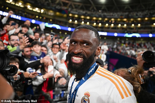 Antonio Rudiger smiles after claiming his second European Cup winners medal after doing so with Chelsea in 2021