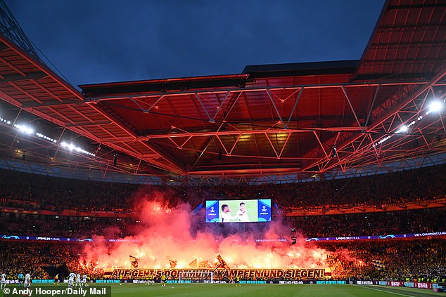 Borussia Dortmund fans set off fireworks ahead of the second half at Wembley Stadium