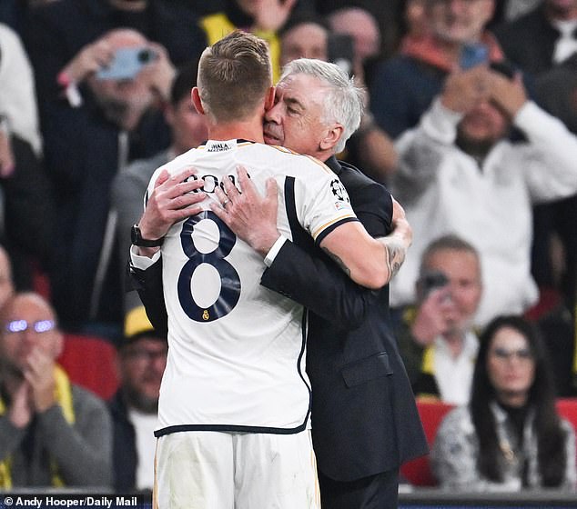 The German shared a moving embrace with his manager after leaving the field to a standing ovation