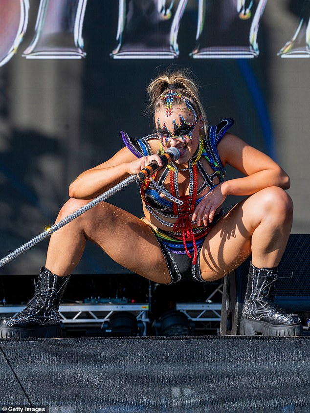 The out-of-this-world outfit helped show off her legs and her toned midriff by splitting the whole thing into two separate pieces, including shoulder wings for the top.