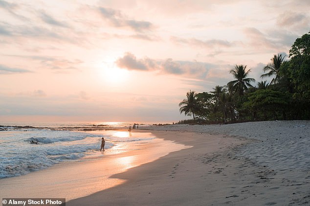 FILE PHOTO: Sunset on the beach in Santa Teresa, Costa Rica