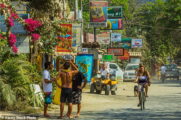 FILE PHOTO: Tourists on the main strip of Santa Teresa on the south coast of the Nicoya Peninsula;  Playa Santa Teresa, Puntarenas, Costa Rica