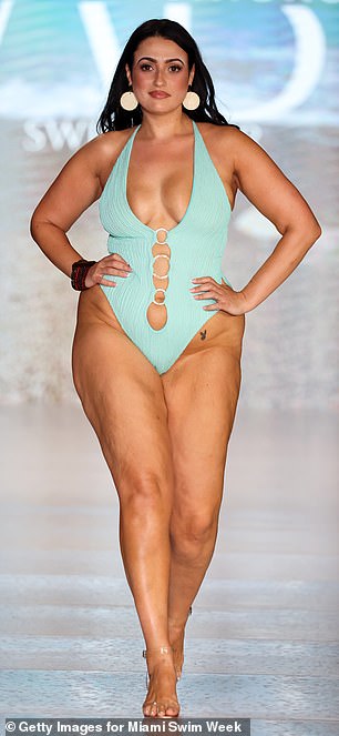 For her second look at the Ashi B Fashions show, Amel wore a duck egg blue halter suit with cutouts along the torso, held together by rings