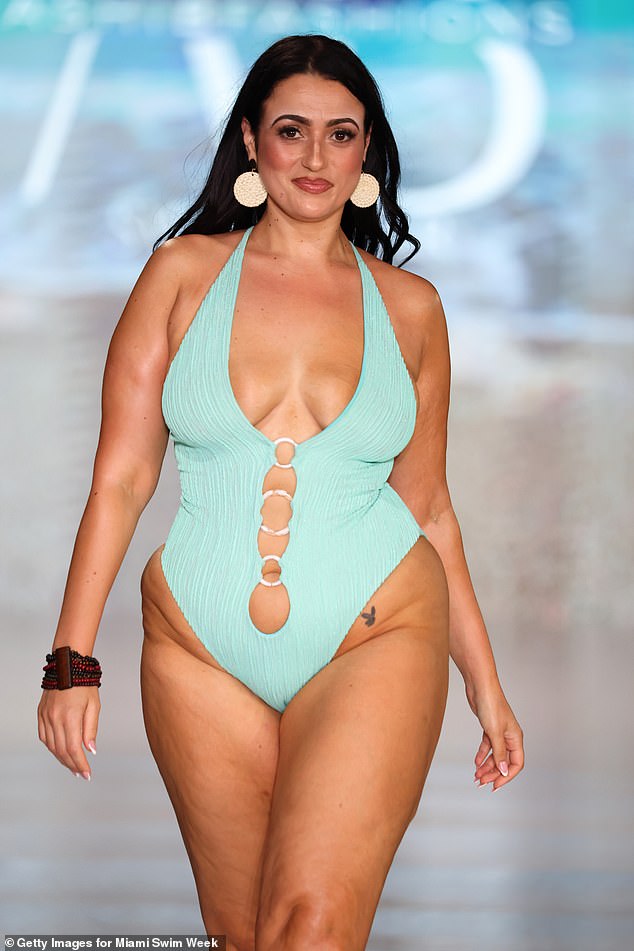 Amel's high-leg swimsuit at the Ashi B Fashions show gave a glimpse of Amel's playboy bunny tattoo on her left hip and she paired it with rattan round earrings and a black and red chunky beaded bracelet