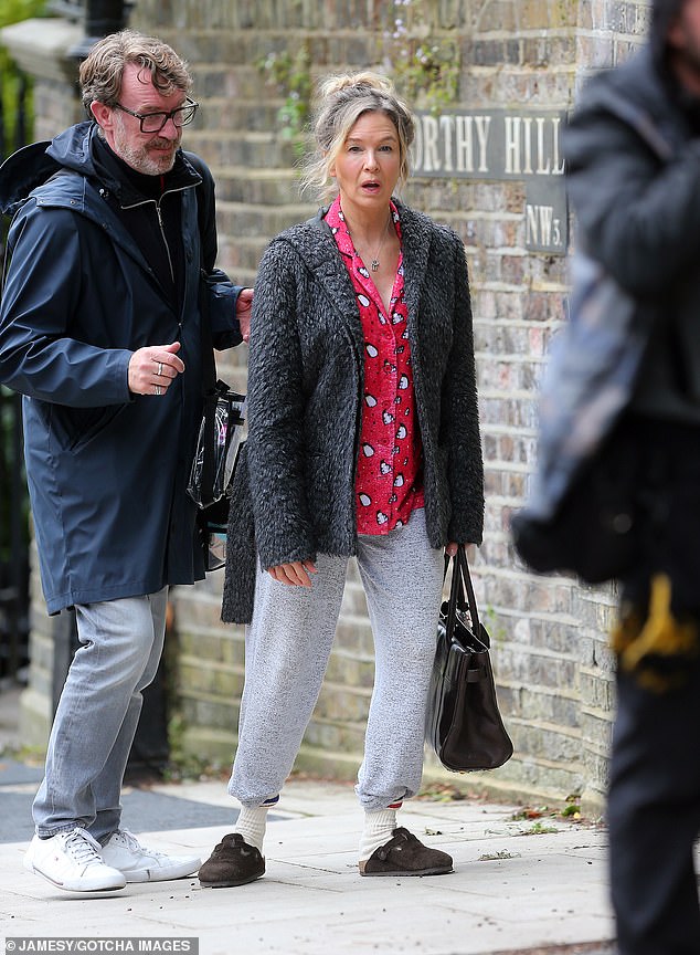 She stepped out in white high socks and brown Birkenstock sandals with a black handbag