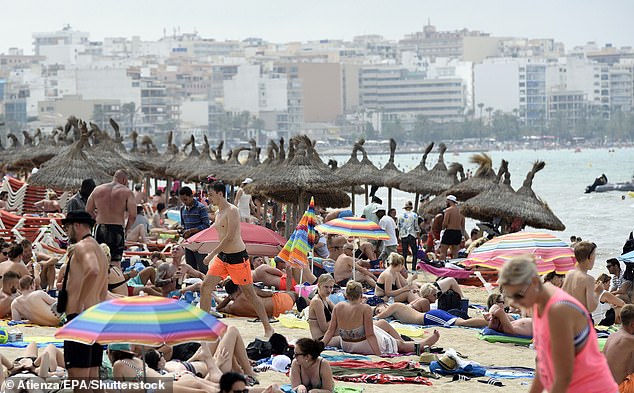A view of Palma beach, full of tourists and locals in Mallorca
