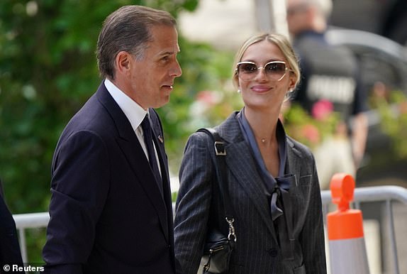 Hunter Biden, son of US President Joe Biden, arrives at federal court with his wife Melissa Cohen Biden, on the opening day of his trial on criminal weapons charges in Wilmington, Delaware, US, June 3, 2024. REUTERS/Kevin Lamarque