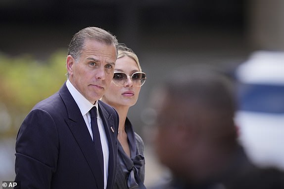 Hunter Biden arrives at federal court, with his wife Melissa Cohen Biden, Monday, June 3, 2024, in Wilmington, Del.  (AP Photo/Matt Rourke)