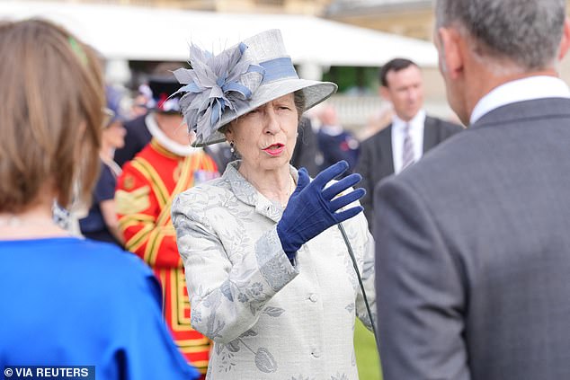 Princess Anne meets guests at the Sovereign's Royal National Lifeboat Institution garden party at Buckingham Palace in May