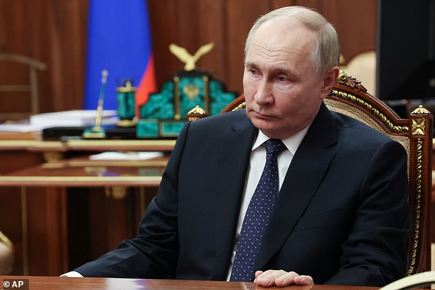 Russian President Vladimir Putin (photo) listens to Archpriest and Chairman of the Board of the Circle of Kindness Foundation Alexander Tkachenko during their meeting in the Kremlin