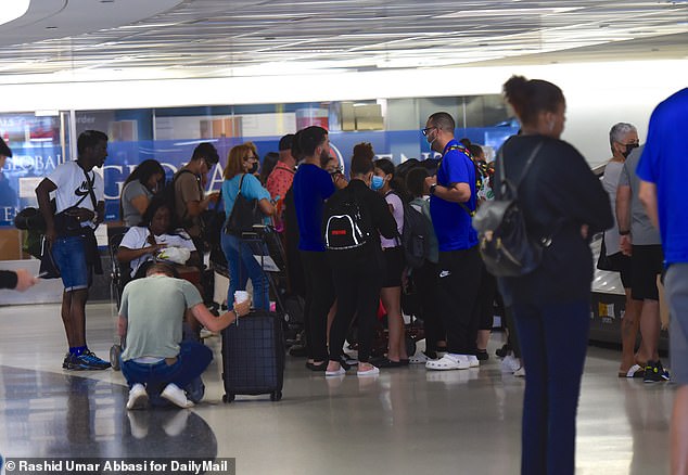 In fourth place came Delta Airlines, where 394,386 suitcases were mishandled out of more than 80 million suitcases flown in.  (Image: Delta passengers wait for luggage at Newark Liberty Airport in New Jersey)