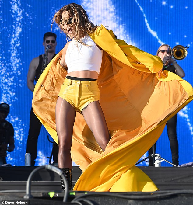 The Shape Of Me singer started her set with an oversized trench coat that perfectly matched her tiny shorts