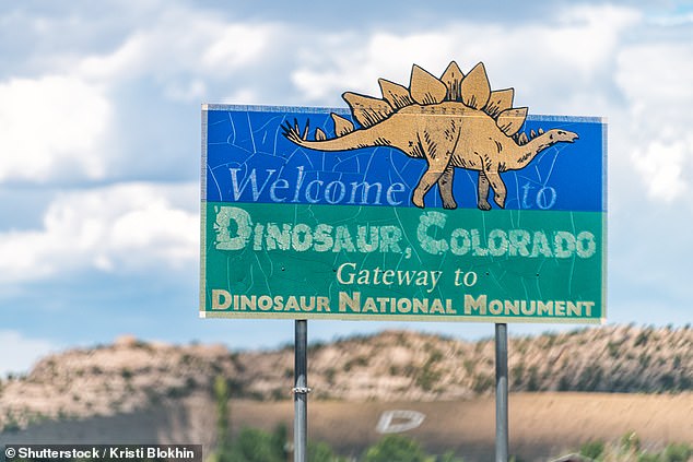 The giant fossil was discovered in May 2022 in Dinosaur, Colorado.  In the photo: Close-up of the city's welcome sign