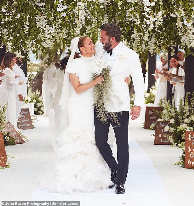 You can't sell people on what they know is complete BS.  Affleck has been walking around looking miserable for almost a year, slamming car doors while J.Lo sits in the passenger seat, sitting glumly at the Grammys while she apparently yells at him to 'look motivated!'.  (Photo: their wedding in 2022).