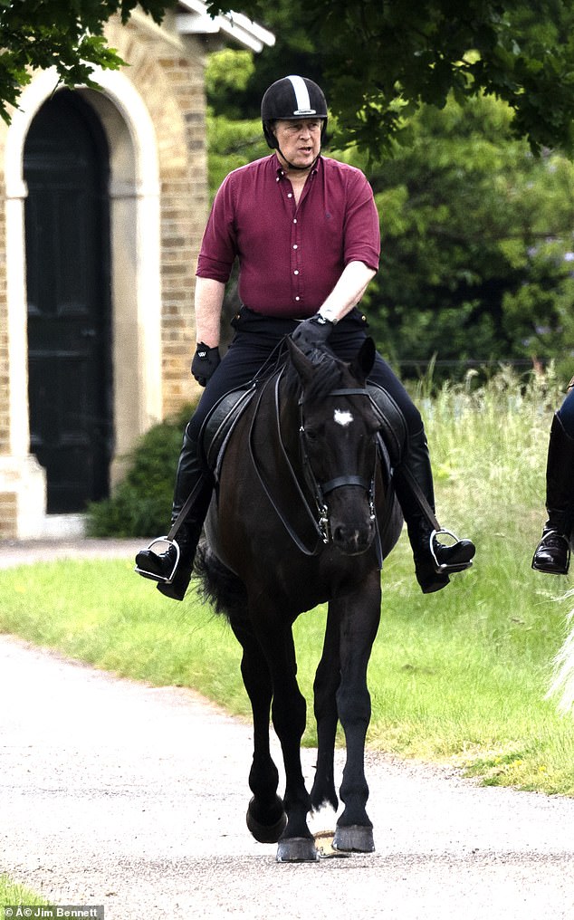 The Duke was seen wearing a burgundy shirt, black trousers and riding boots as he took a ride around the grounds