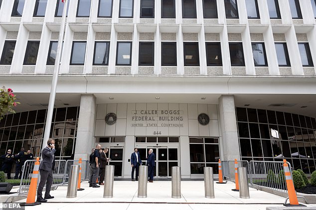 Security stands outside the J. Caleb Boggs Federal Building in Wilmington, Delaware, where Hunter Biden's gun trial began Monday.  The first son will appear before a judge appointed by Trump but approved by Delaware's two Democratic senators