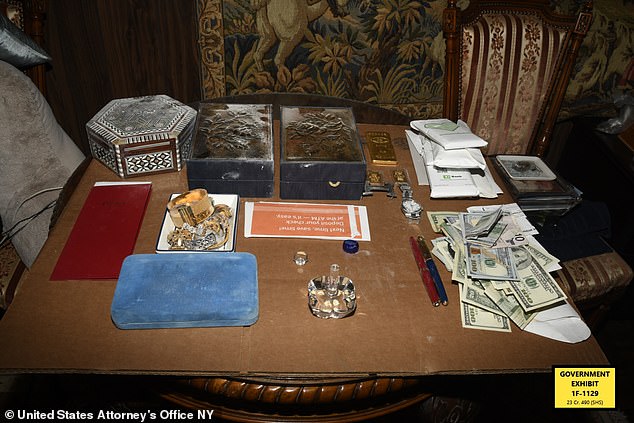 During the raid, authorities found $480,000 in cash scattered throughout the home