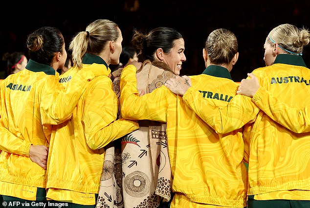 The Australian Matildas teammates hug Williams after the Booka presentation