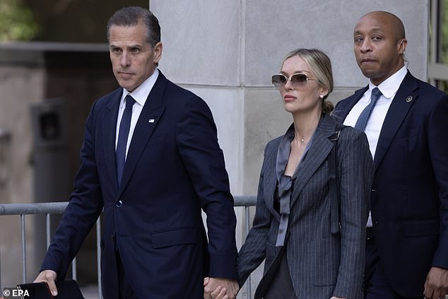 Hunte Biden (left) holds the hand of his wife Melissa Cohen (right) as he arrived Monday at Federal District Court in Wilmington, Delaware, where he is on trial for lying about his sobriety while buying a gun