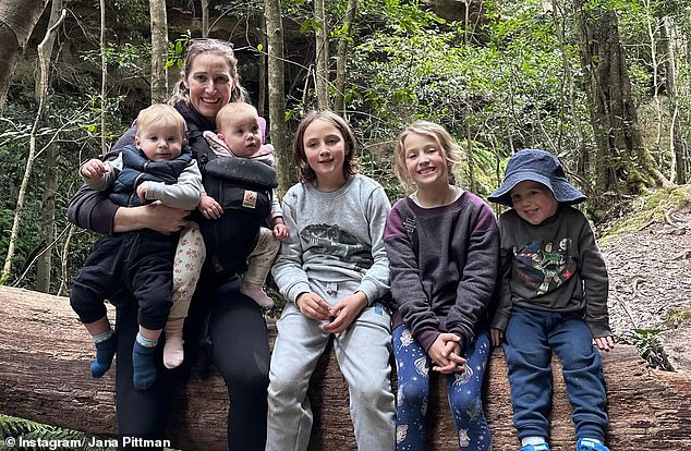 Pittman (pictured with her children) says she still regrets not reaching her full potential on track