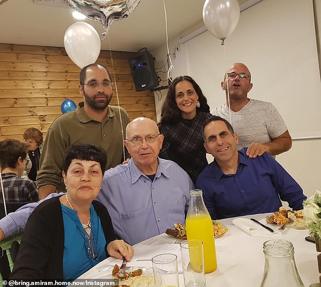 Amiram and Nurit in the photo with their son Rotem, who is sitting next to his father