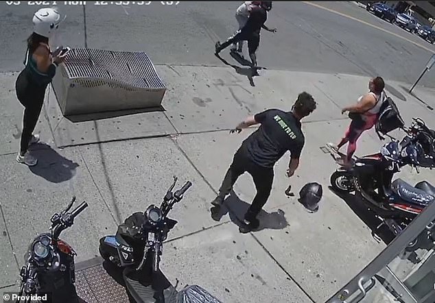 The 35-year-old suspect ran onto the road, closely followed by another man.  The abandoned helmet lies on the side of the road