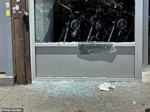 The smashed windows can be seen after a suspect's manic attack on Monday