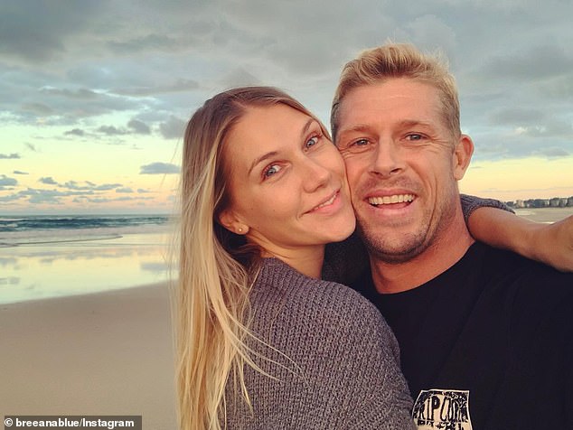 Fanning (pictured with partner Breeana Randall) has spoken about how important friends and family are in the battle against depression