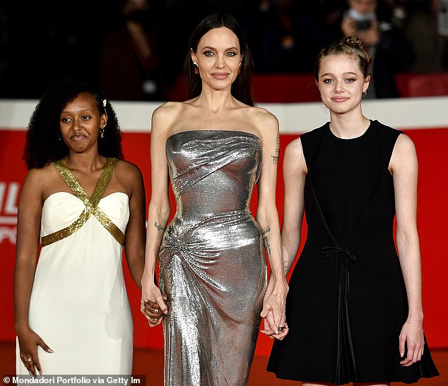 “The memory of losing his children is obviously not easy for Brad,” the source continued.  “He loves and misses his children.  It's very sad';  Angelina Jolie (center) pictured with daughters Zahara (L) and Shiloh (R) in 2021 in Rome