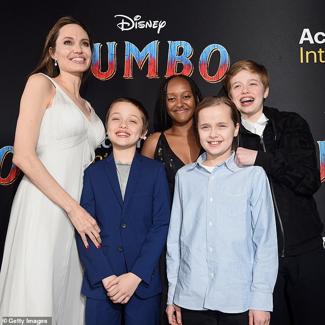 Zahara (center) dropped “Pitt” when she introduced herself to her sorority last year, and Vivienne (second from right) called herself “Vivienne Jolie” in a Playbill for The Outsiders;  Angelina with (L¿R) Knox, Zahara, Vivienne and Shiloh in 2019 in LA