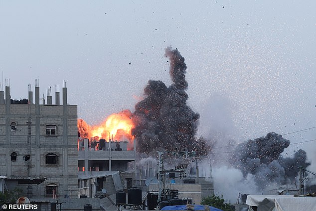 Smoke and flames rise during an Israeli airstrike in the center of the Gaza Strip