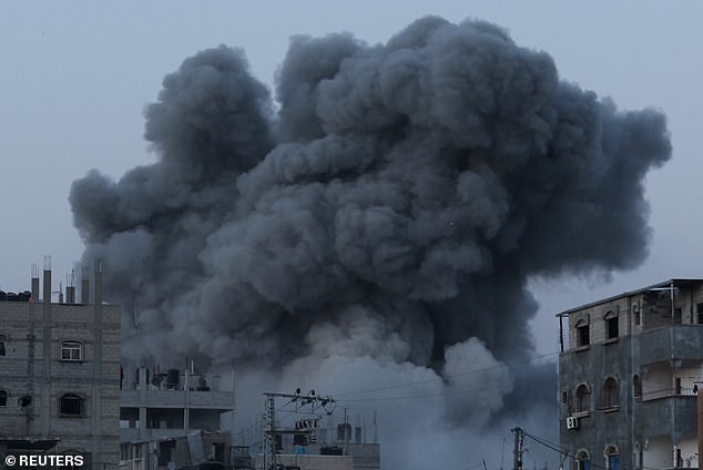 Smoke rises during an Israeli airstrike in the center of the Gaza Strip