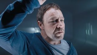 A close-up of Stephen Graham's Patrick Mulligan in a cell in Venom 3