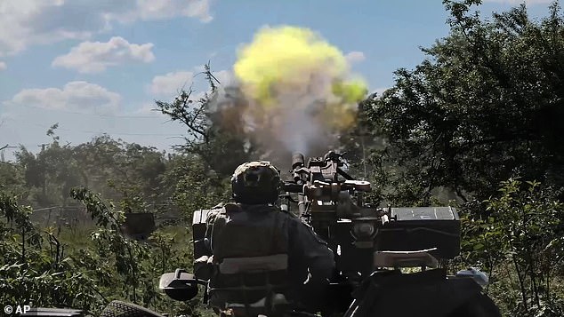 In this photo released by the press service of the Russian Ministry of Defense on Sunday, June 2, 2024, a Russian soldier operates a gun at a secret location in Ukraine