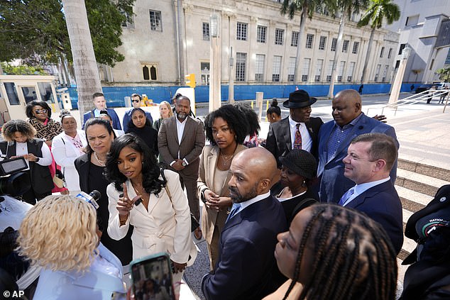 Co-founders and CEOs of The Fearless Fund Arian Simone, center left, and Ayana Parsons, center right, speak to reporters outside the federal courthouse in Miami