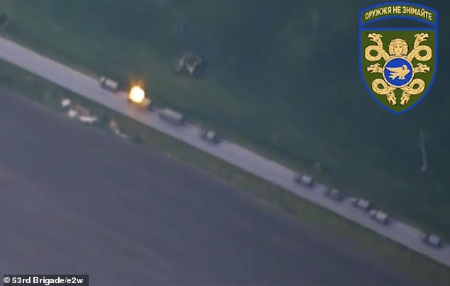 A truck is seen exploding after being hit by a Ukrainian drone