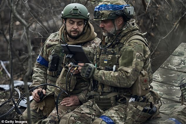 Pilots of the "Sharp Kartuza" A division of FPV kamikaze drones prepares drones for a combat flight on May 16 in the Kharkiv region