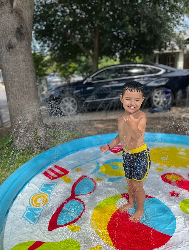 Javier is pictured above playing in the water in happier times before he became infected