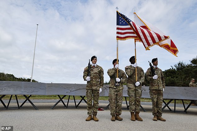 Active duty American soldiers stand in position at Pointe du Hox prior to the D-Day commemoration