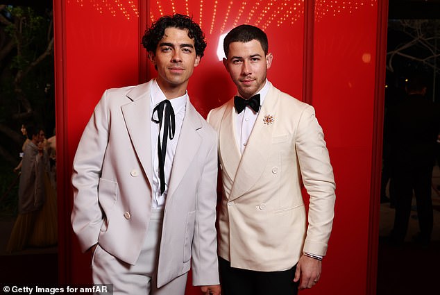 Joe also made a surprise appearance at the amFAR Gala in Cannes, which Demi hosted.  She was seen swaying her hips to his song Cake by the Ocean.  Nick was scheduled to perform that night, but Joe was not